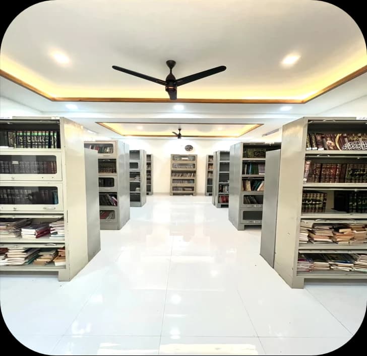 Albayan Library book stacks and illuminated reading aisles